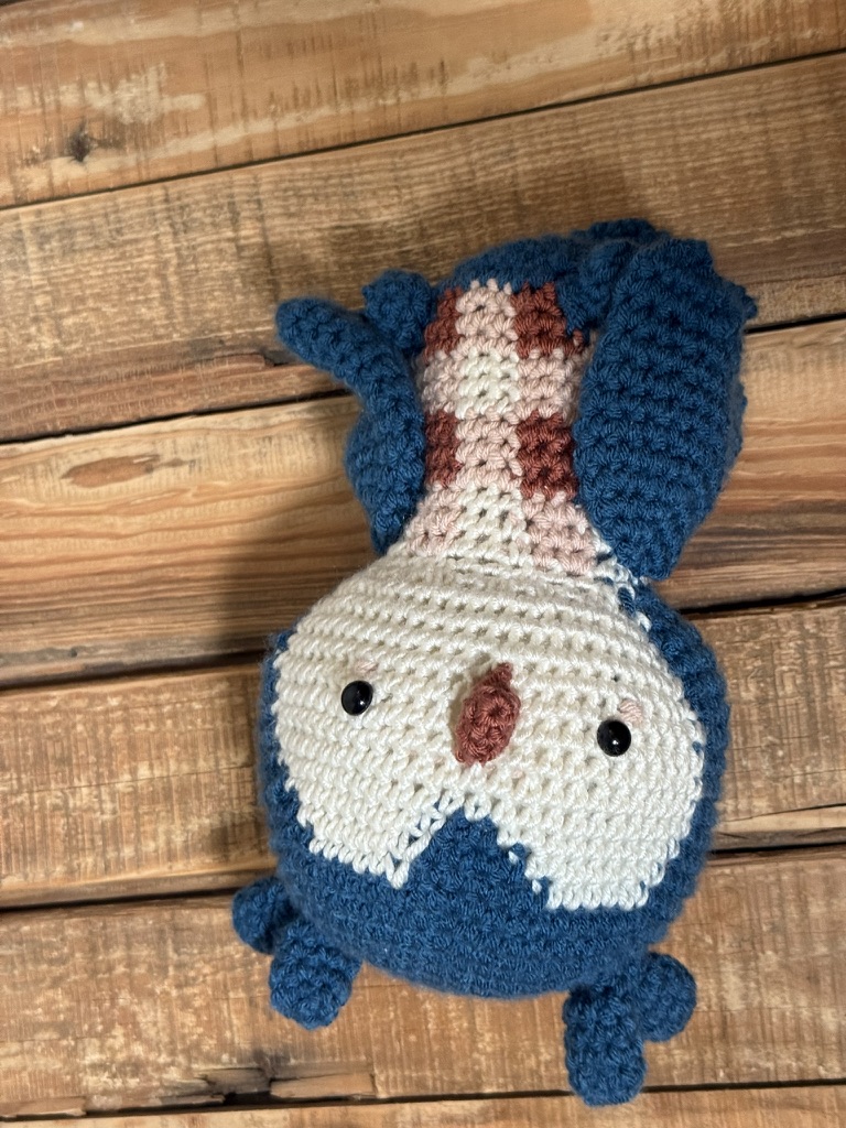 Otis the Owl, a round blue crocheted owl